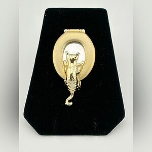 Vintage AJC cat looking inside toilet lid